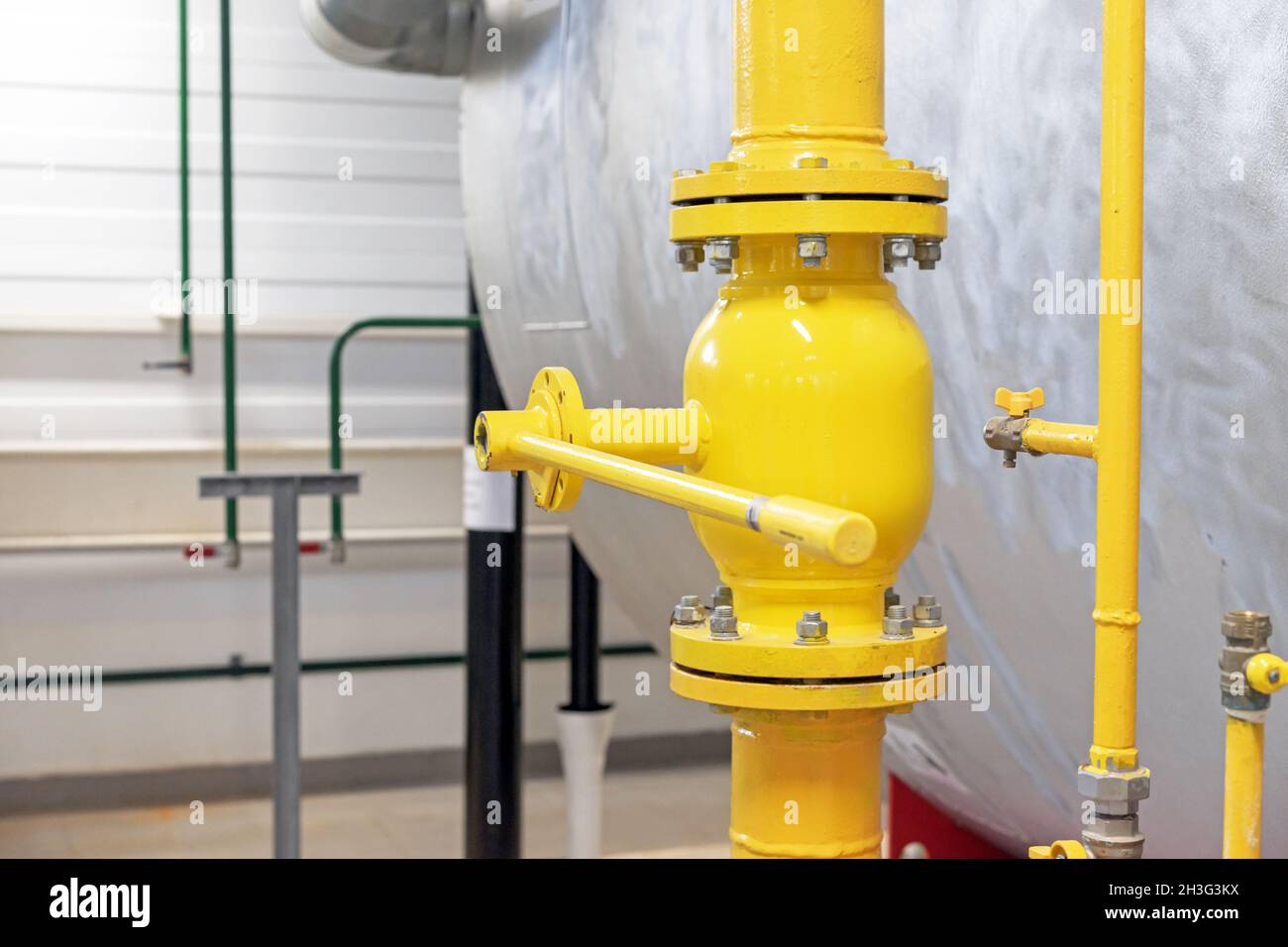 Gas shut-off valve at gas processing station. Valve on the gas boiler house. Stock Photo