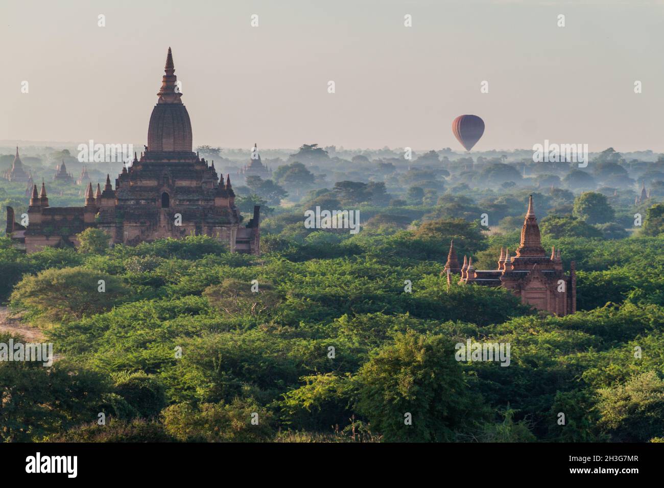 Balloon over Bagan - hot air balloons floating among the skyline of temples, Myanmar Stock Photo