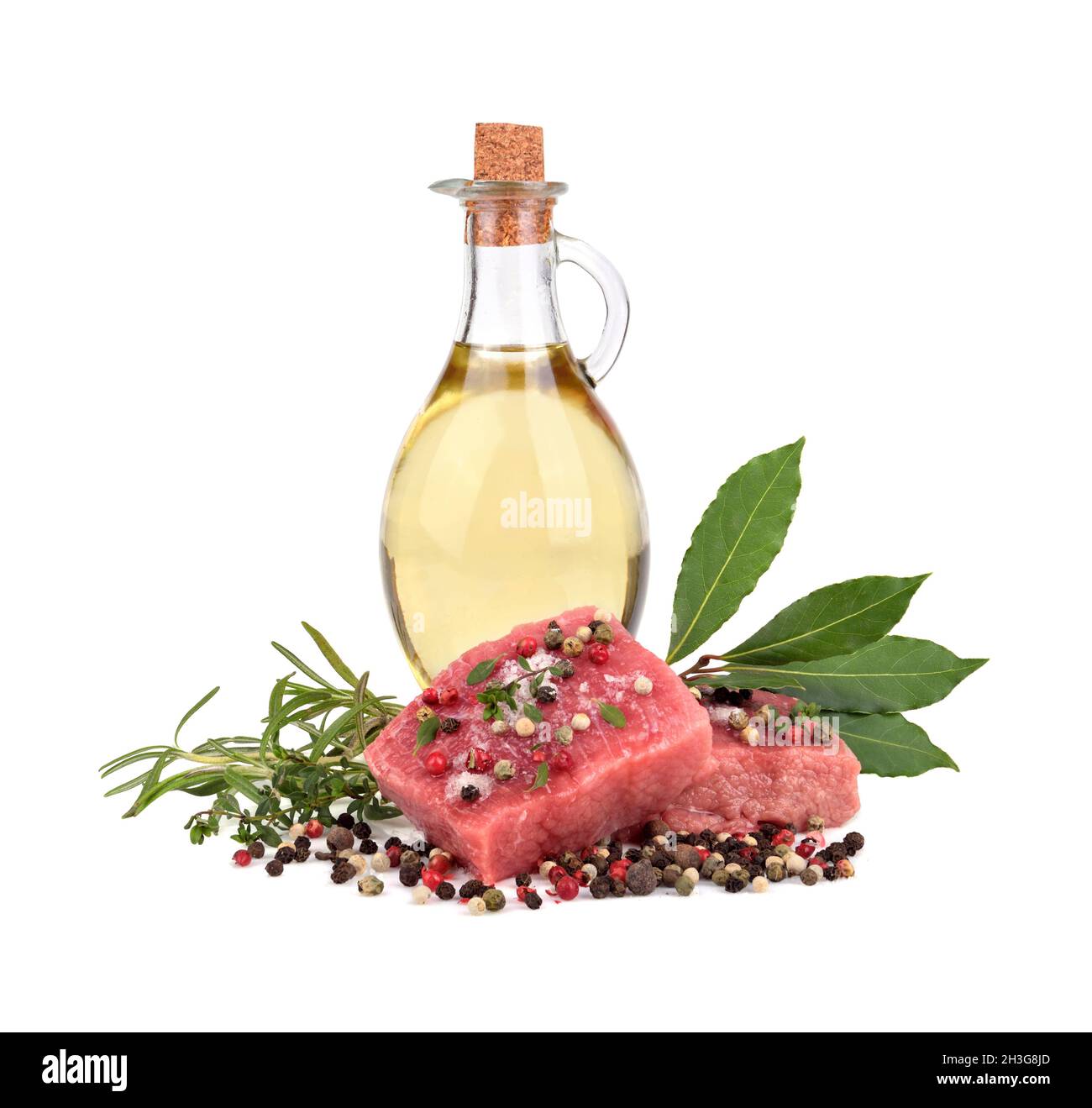 Fresh raw beef meat slices with bay leaves, olive oil, color peppercorn