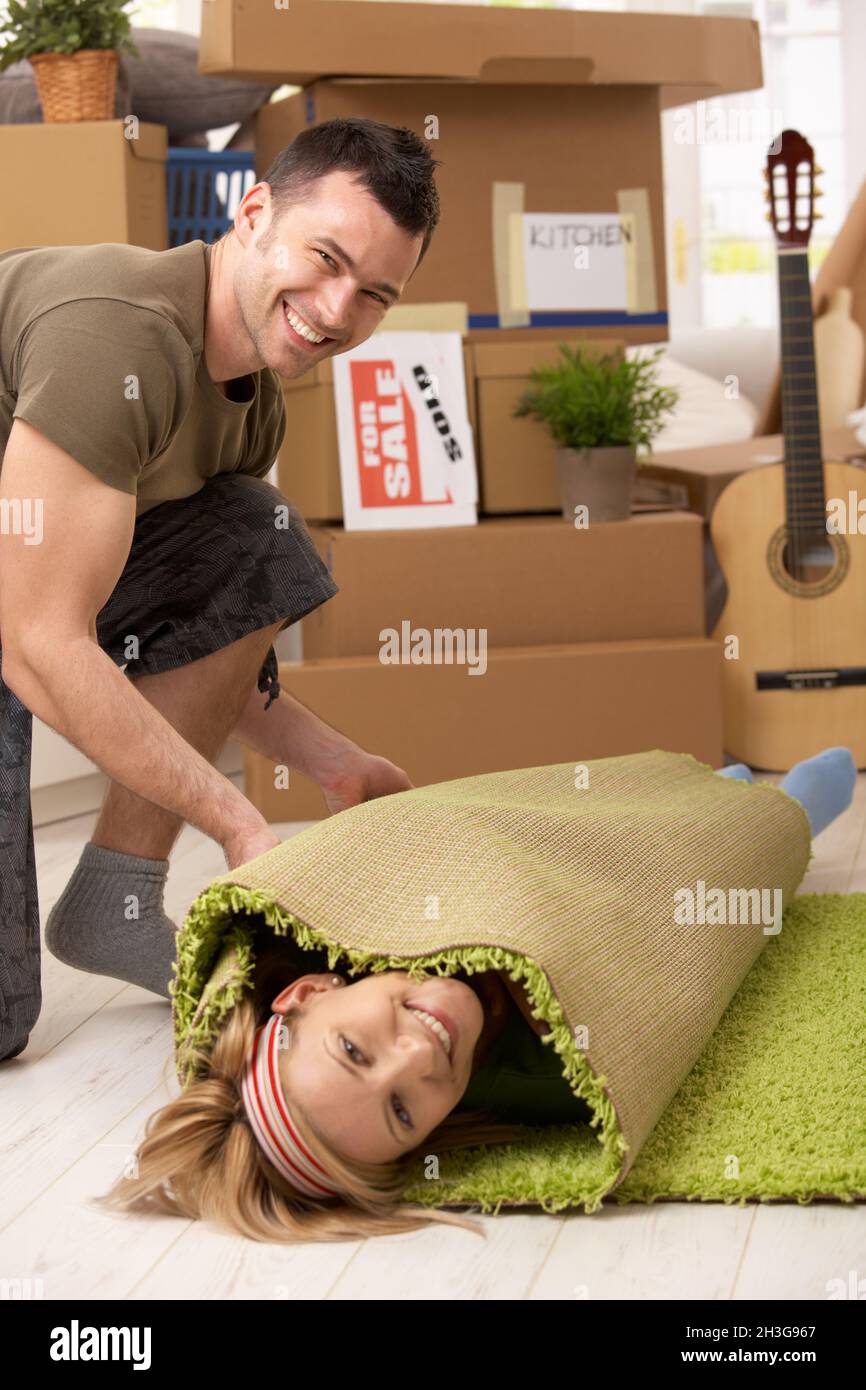 Young couple having fun at moving house Stock Photo