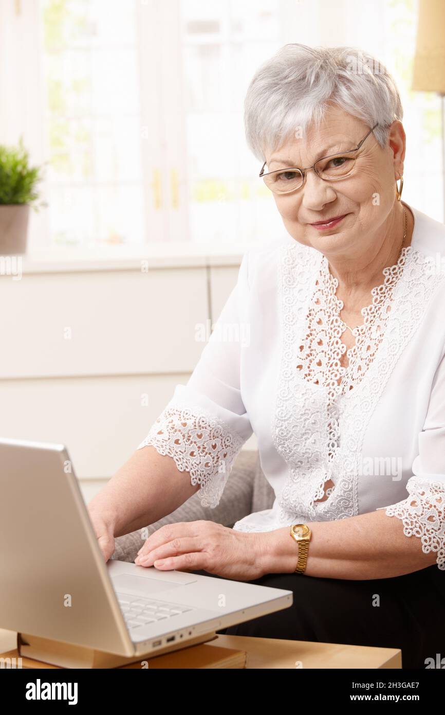 Senior woman using computer Stock Photo - Alamy