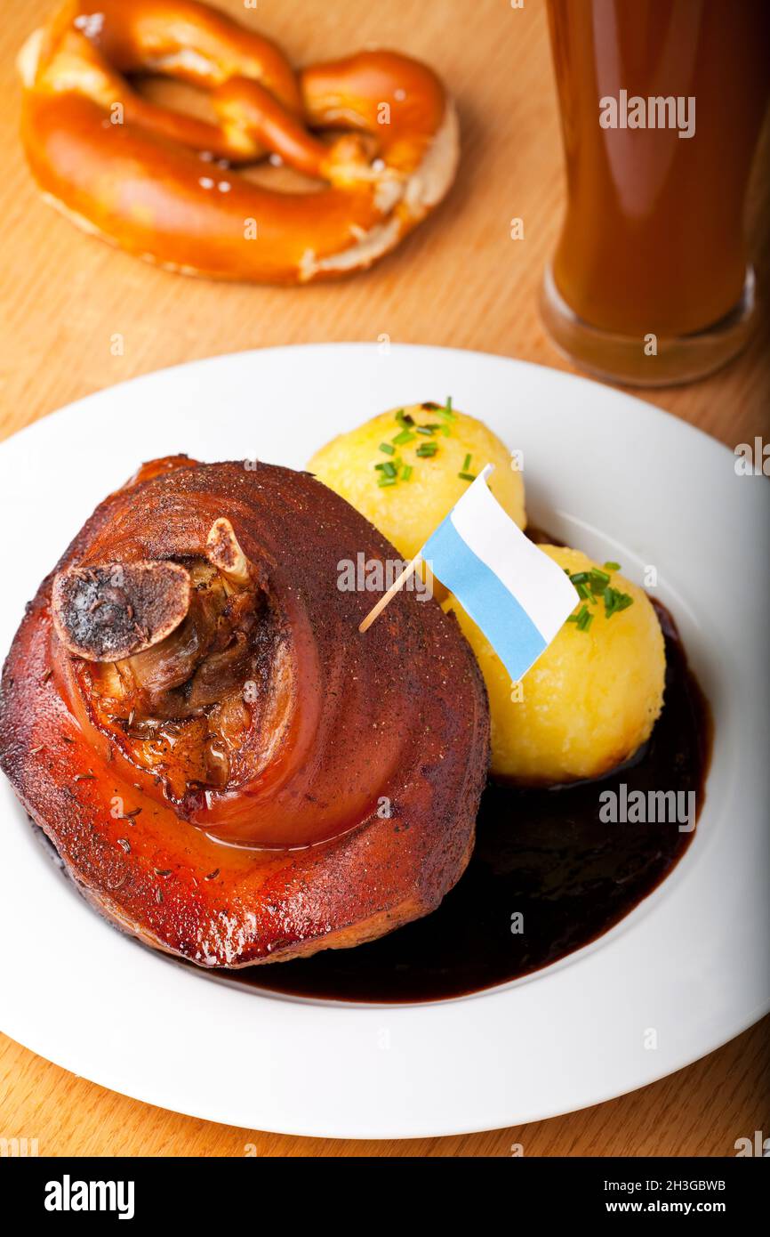Bavarian knuckle of pork with potato dumplings Stock Photo
