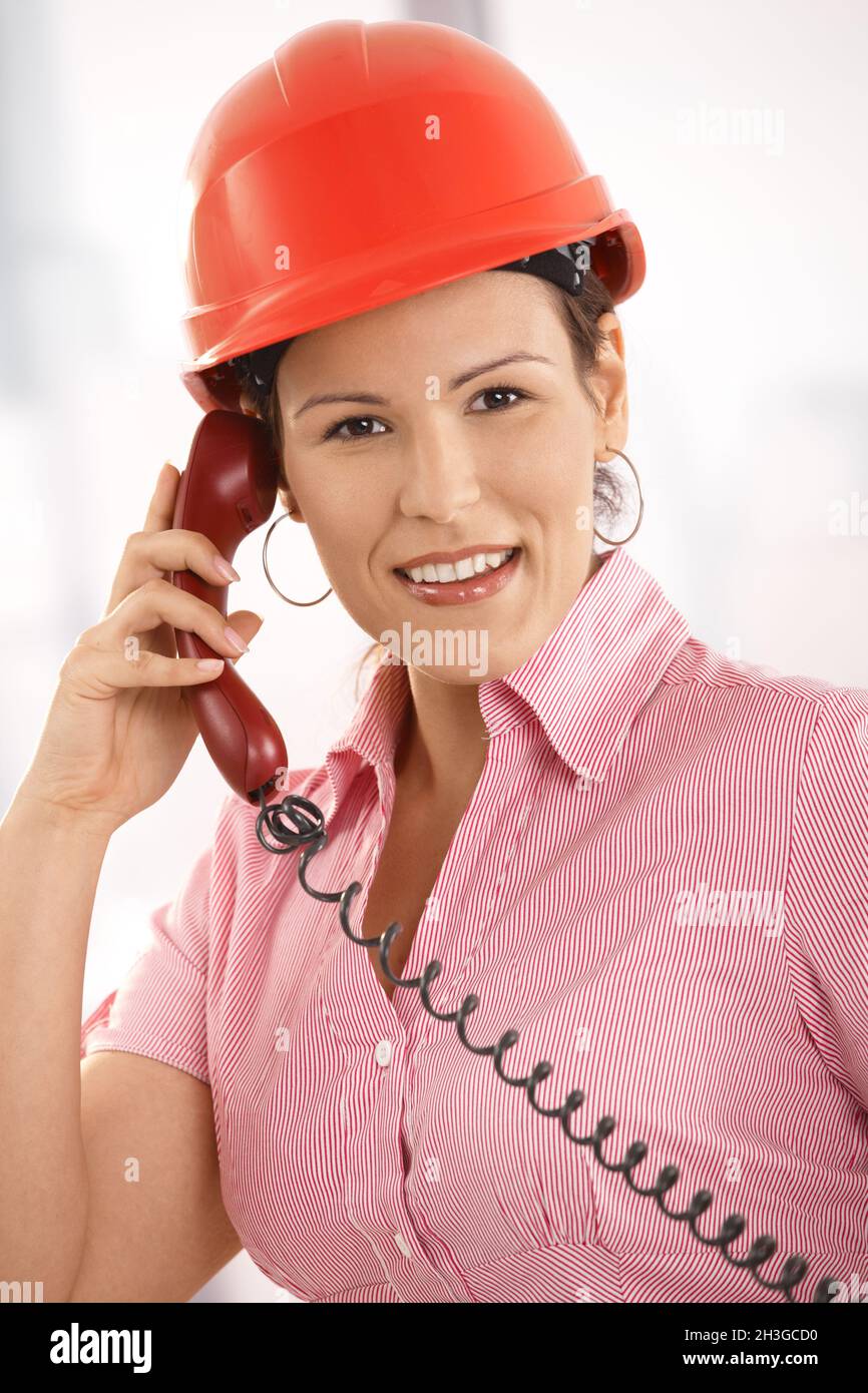 Female architect talking on phone Stock Photo