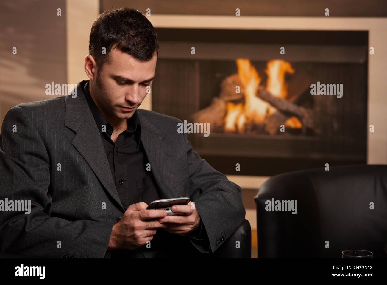 Businessman writing text message Stock Photo - Alamy