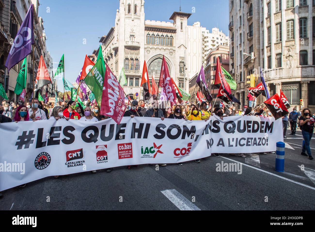 Barcelona, Spain. 28th Oct, 2021. Protesters holding a banner and flags  expressing their opinion during the demonstration. The CGT (General Labor  Confederation of Catalonia) and the IAC (Alternative Inter-Union of  Catalonia) have