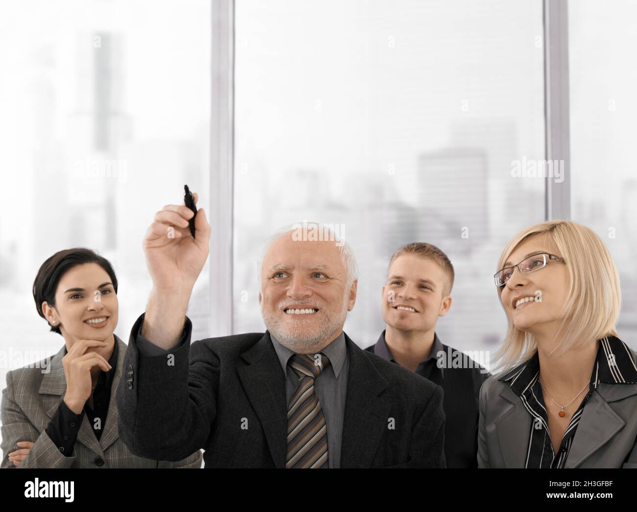 Senior businessman drawing with marker pen Stock Photo