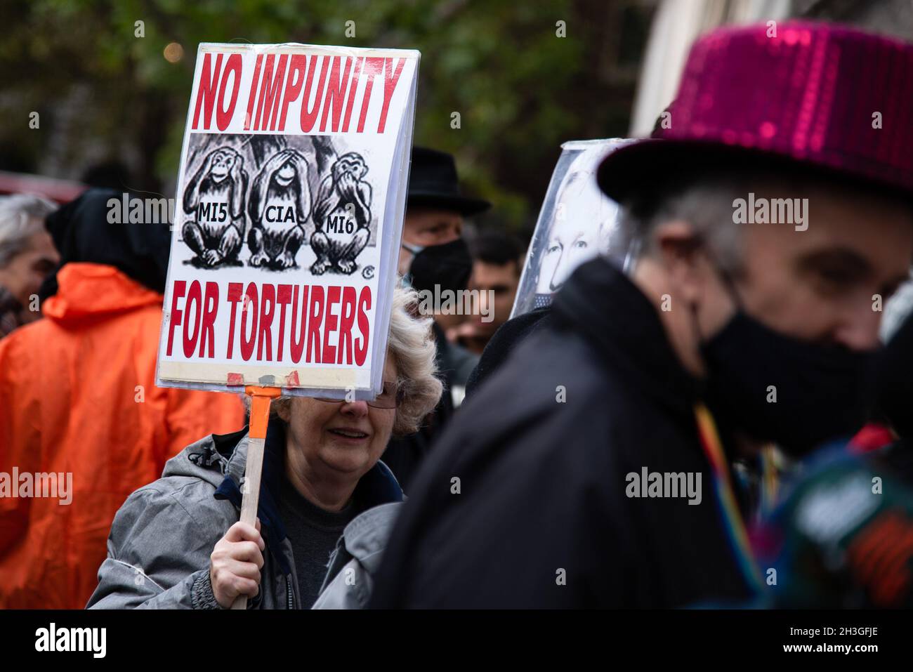 a-protester-holds-a-placard-expressing-his-opinion-during-the