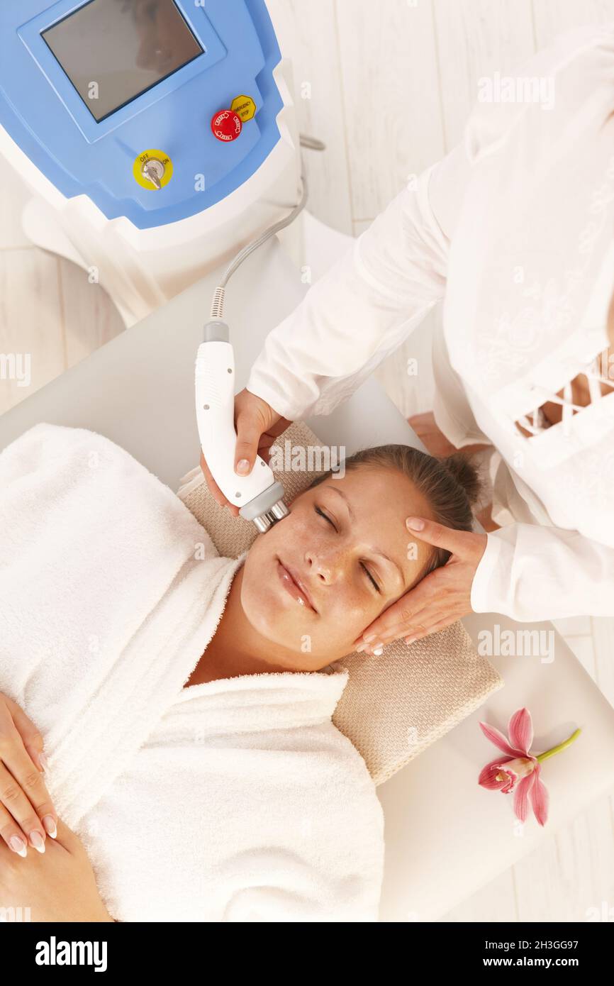 Woman getting radio frequency treatment Stock Photo