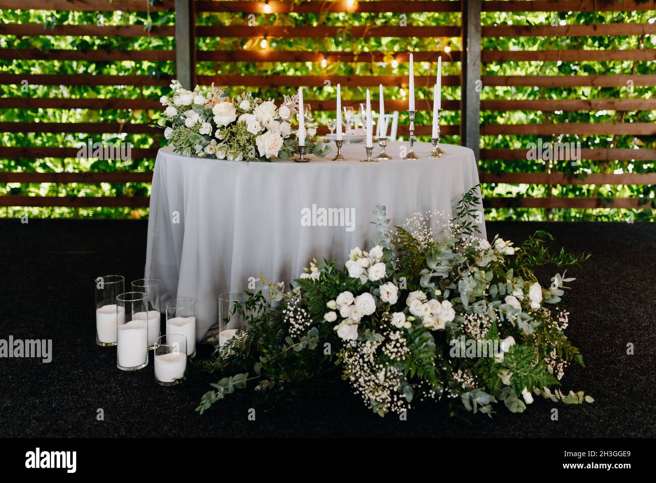 Wedding table decorated with natural flowers and candles Stock Photo ...