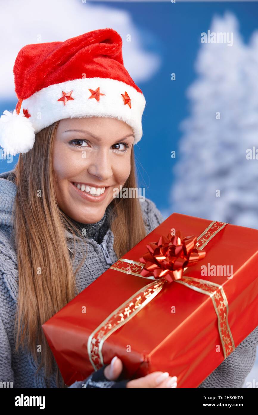 Santa handing woman present hi-res stock photography and images - Alamy