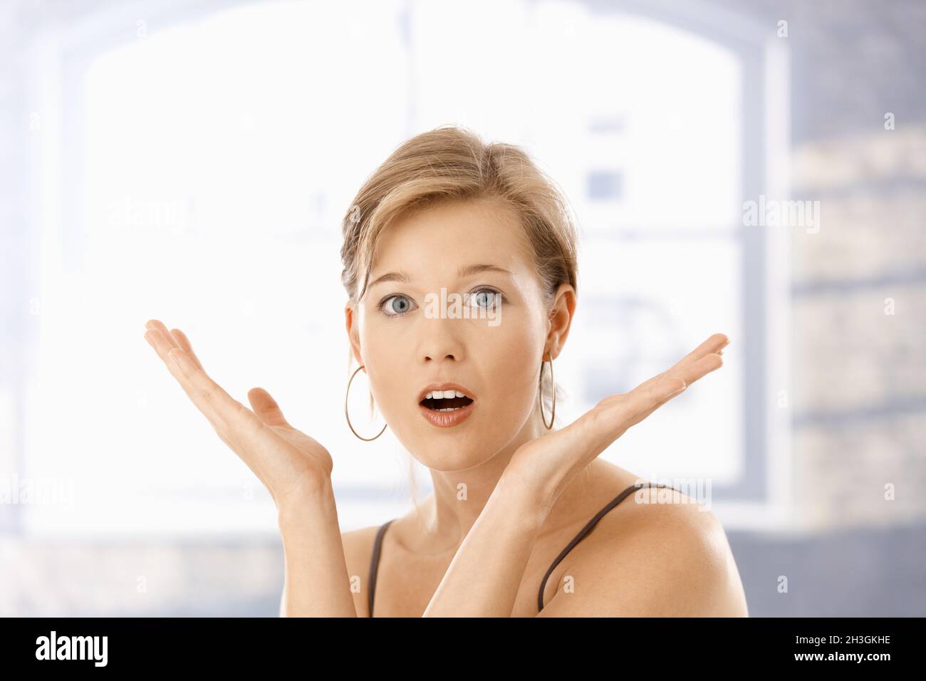 Portrait of surprised young woman Stock Photo - Alamy