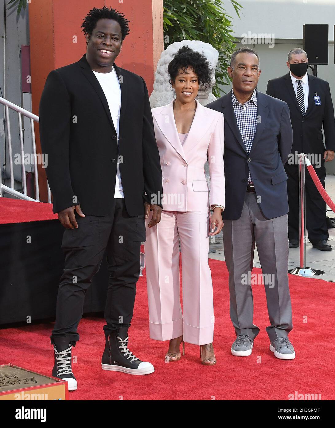 Los Angeles, USA. 28th Oct, 2021. (L-R) Jeymes Samuel, Regina King, and James Lassiter at Regina King's Hand & Footprint Ceremony held at the TCL Chinese Theatre in Hollywood, CA on Thursday, ?October 28, 2021. (Photo By Sthanlee B. Mirador/Sipa USA) Credit: Sipa USA/Alamy Live News Stock Photo
