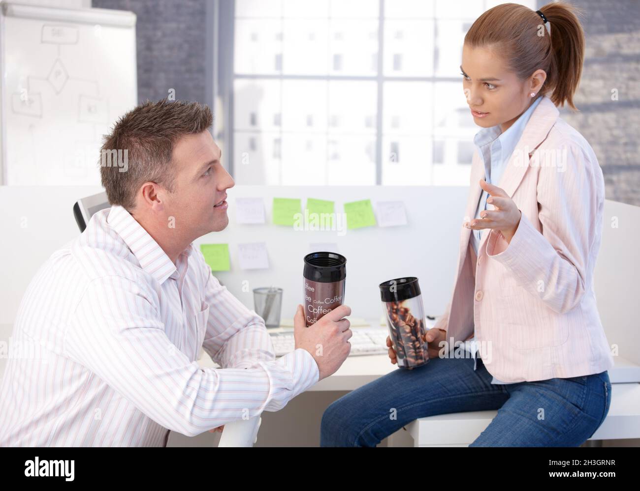 Casual office workers having coffee break chatting Stock Photo