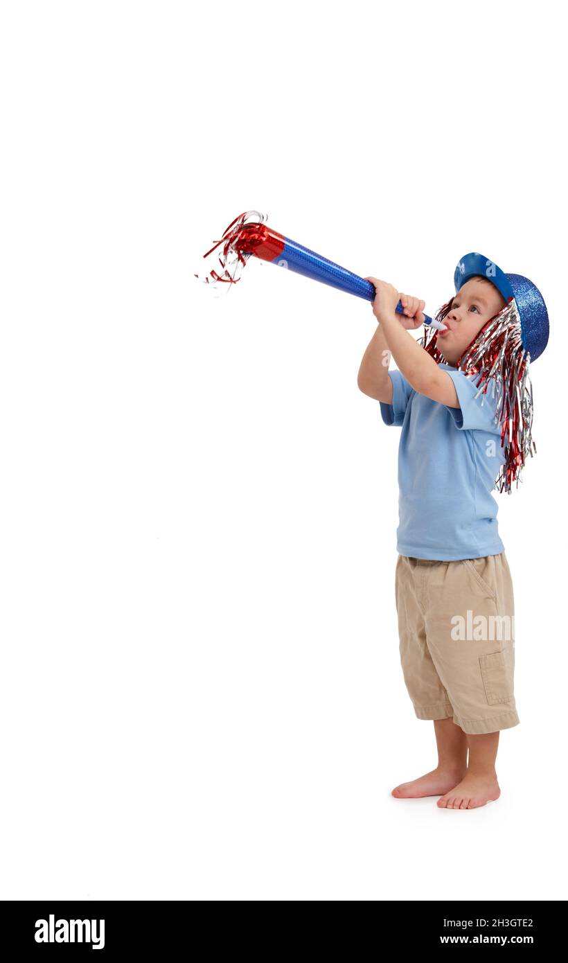 Happy little kid with party horn Stock Photo Alamy