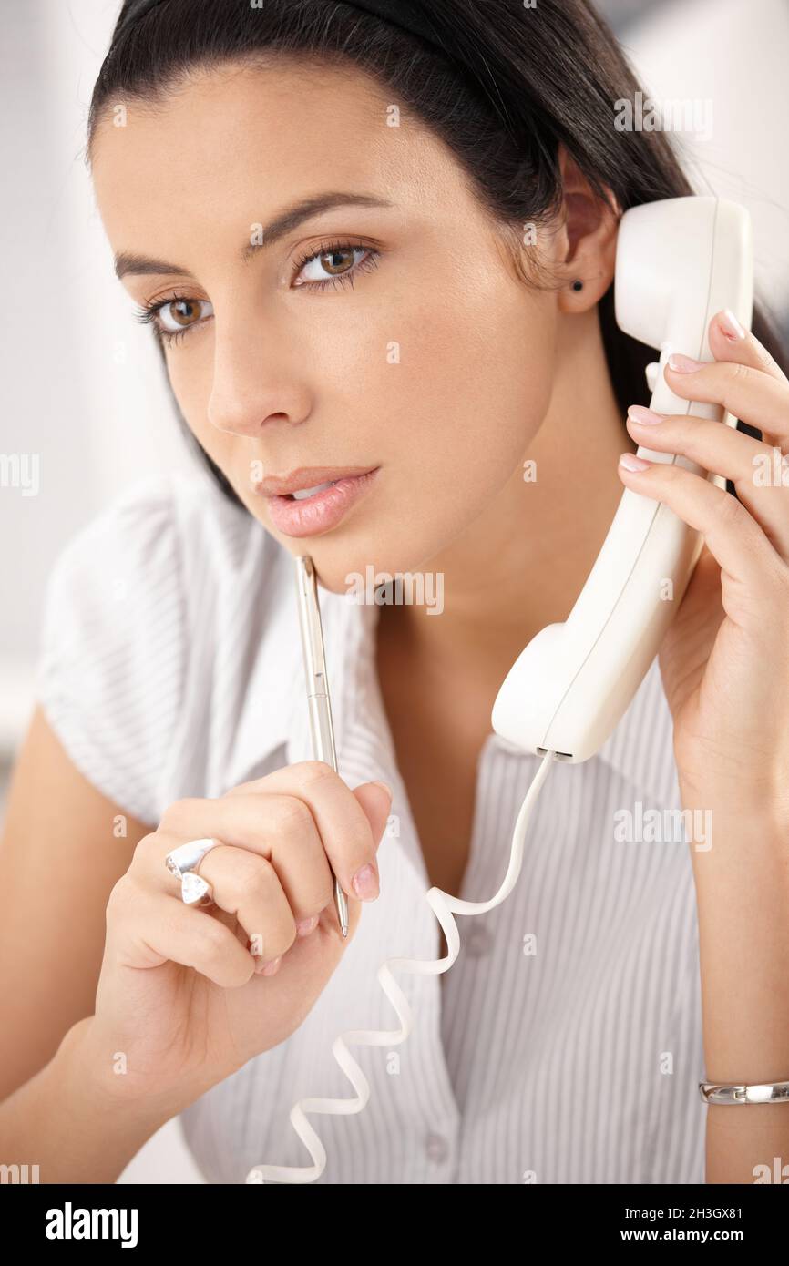 Woman concentrating on call Stock Photo