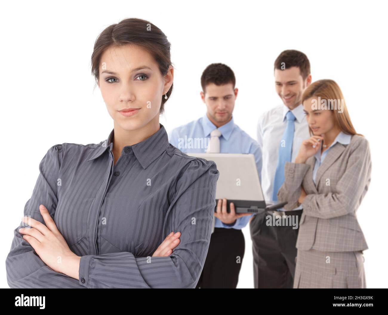 Young businesswomen in front of team Stock Photo