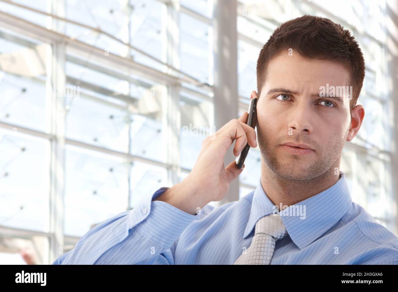 Handsome businessman on mobile Stock Photo