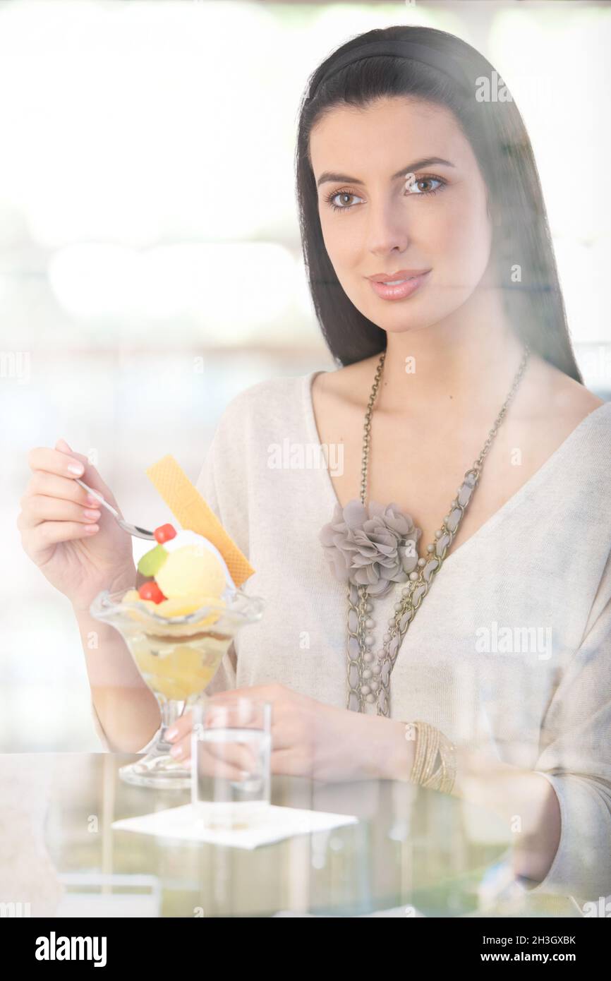 Happy woman having ice cream Stock Photo