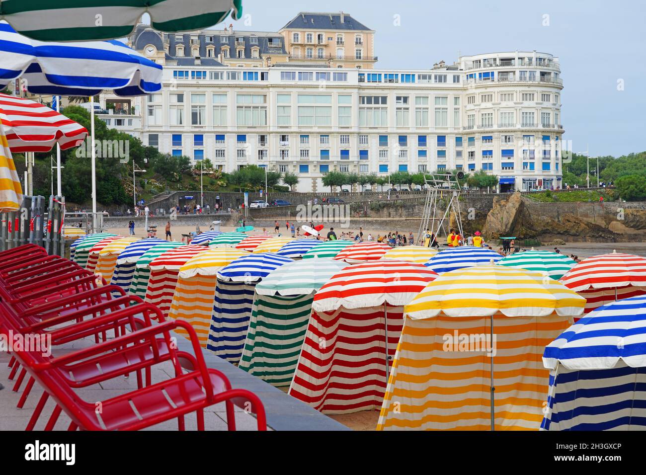 BIARRITZ, FRANCE -19 AUG 2021- Colorful striped beach changing cabanas and  umbrellas on La Grande Plage beach in the resort town of Biarritz in the B  Stock Photo - Alamy