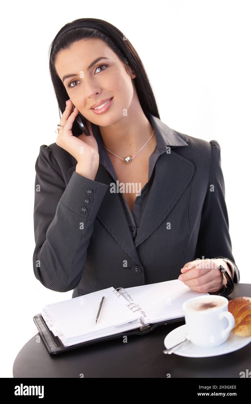 Businesswoman working at coffee break Stock Photo