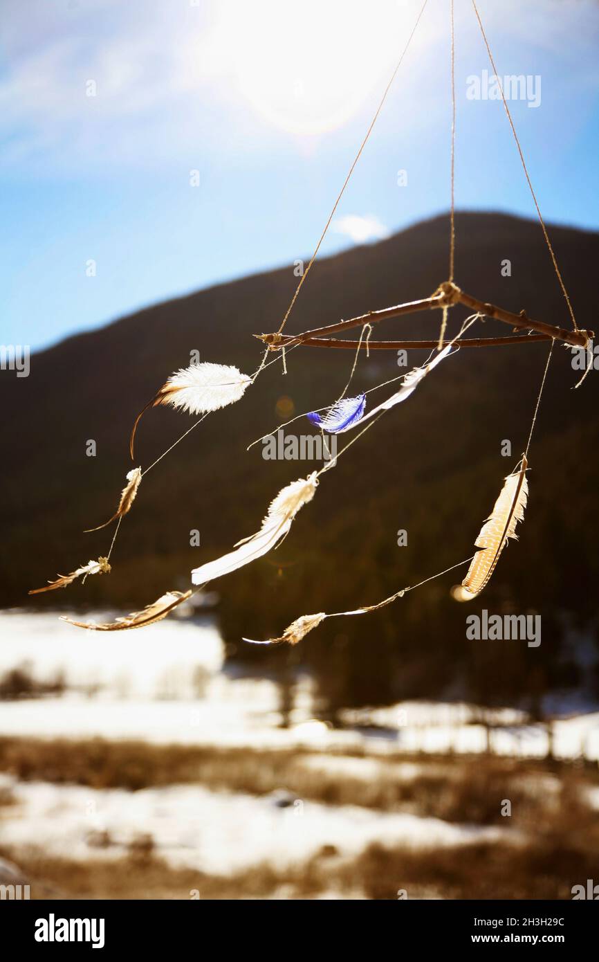 Feathers of dreamcatcher blowing in the wind. Stock Photo