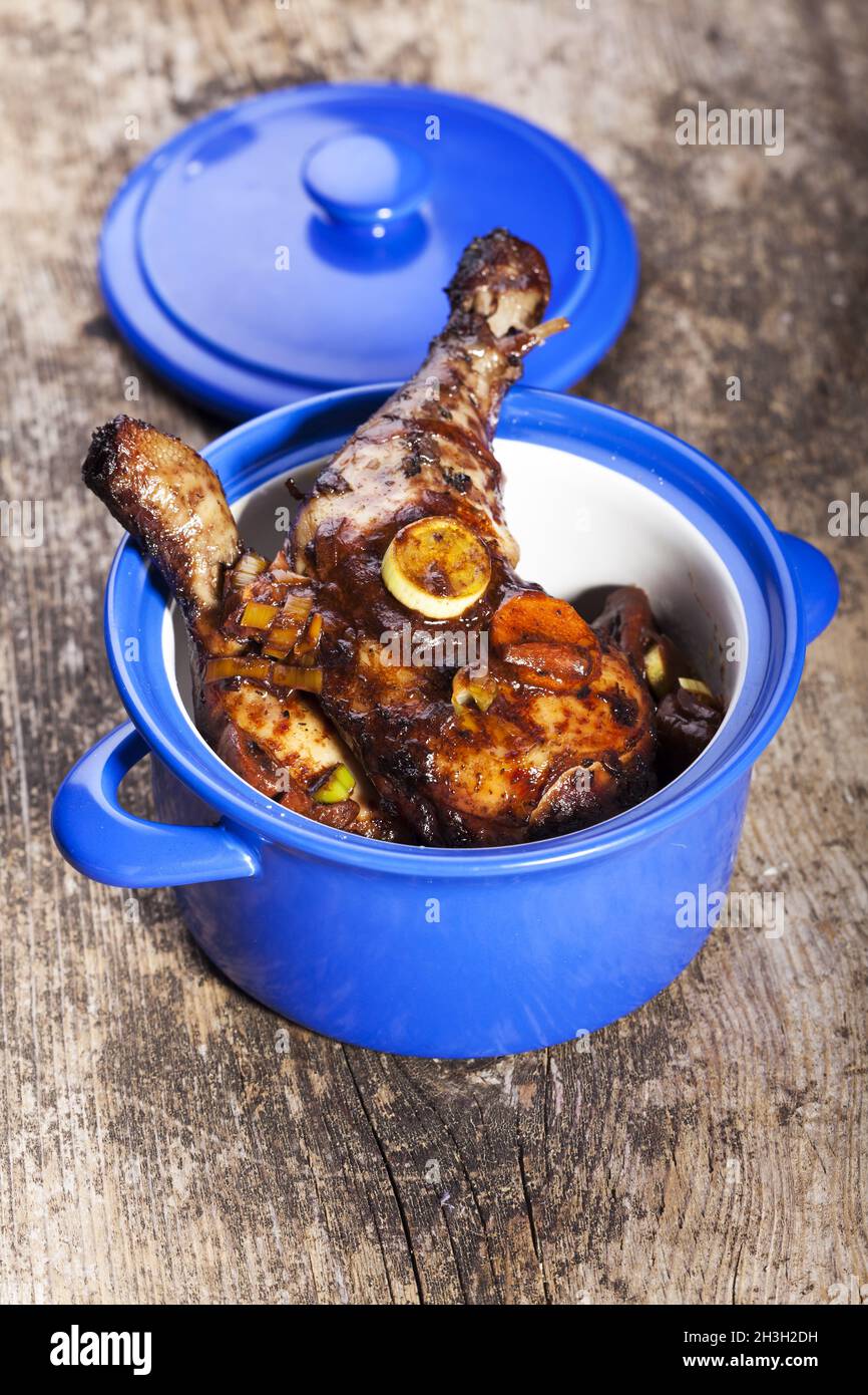 Coq Au Vin in a blue pot Stock Photo