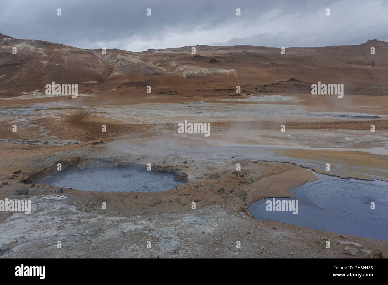 Myvatn Region, Iceland: Namafjall (also known as Hverir) is a high-temperature geothermal area with boiling mud pots and steaming fumaroles. Stock Photo