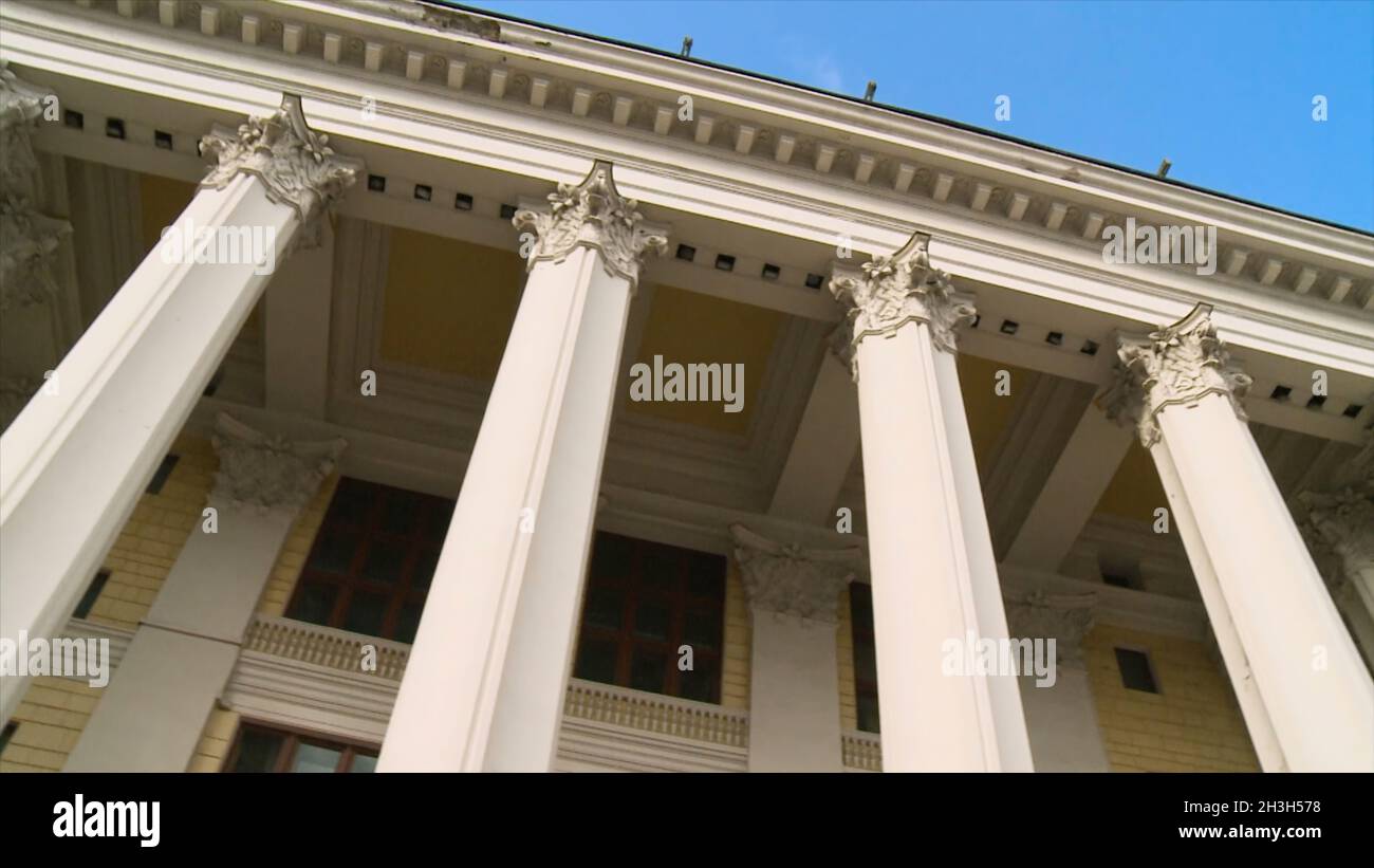 Close-up of a line of Greek-style columns. Scene. Old building with columns Stock Photo