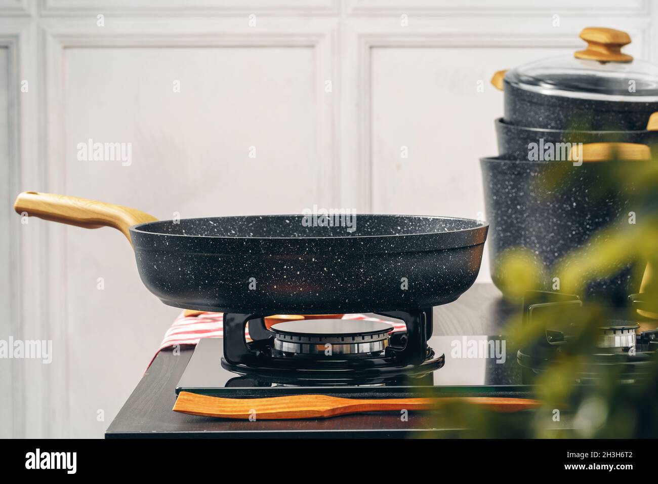 Frying pan on the gas stove in a kitchen Stock Photo Alamy