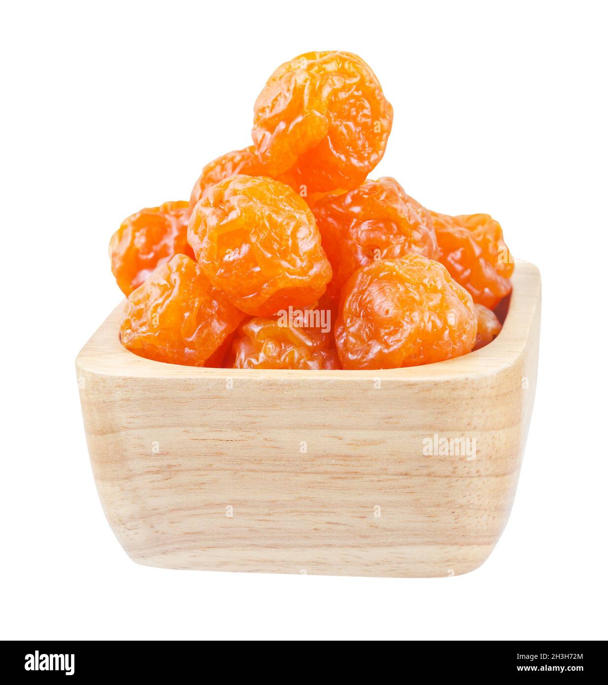Dried prunes fruits (Preserved fruits Chinese plum) in wooden bowl