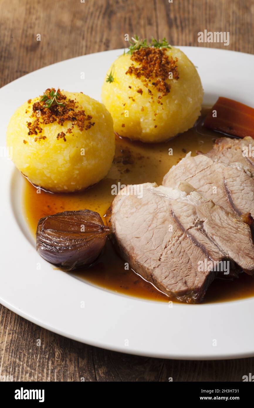 Bavarian roast pork and potato dumplings Stock Photo