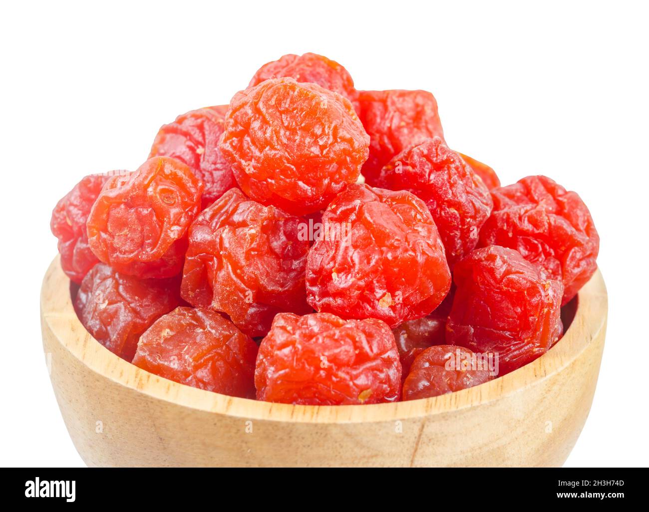 Dried red prunes fruits (Preserved fruits Chinese plum) in wooden bowl
