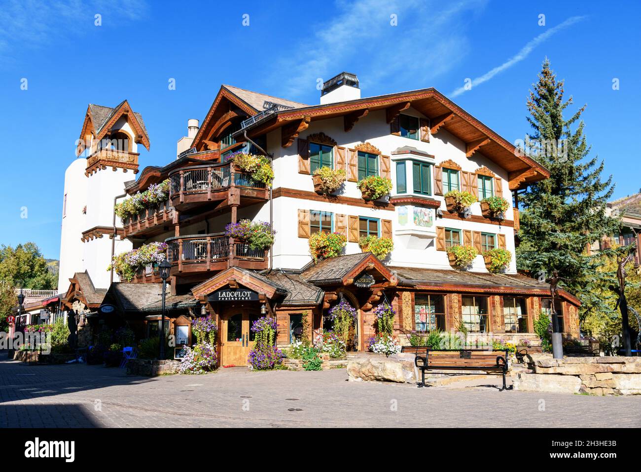 Beautiful bavarian style Bell Tower Residences building on Gore Creek Drive, hosting famous Lancelot Restaurant and Axels Clothing- Vail, Colorado, US Stock Photo