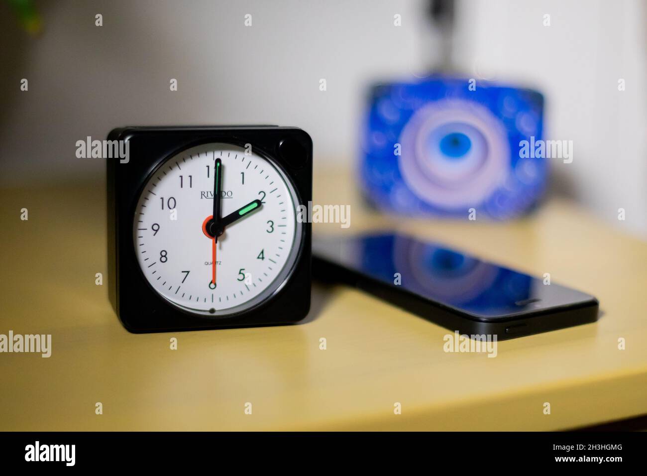 Berlin, Germany. 27th Oct, An alarm clock on a bedside table shows 2 o'clock (posed scene). On 31.10.2021 daylight time (CEST) ends, it is Central European Standard Time again, which