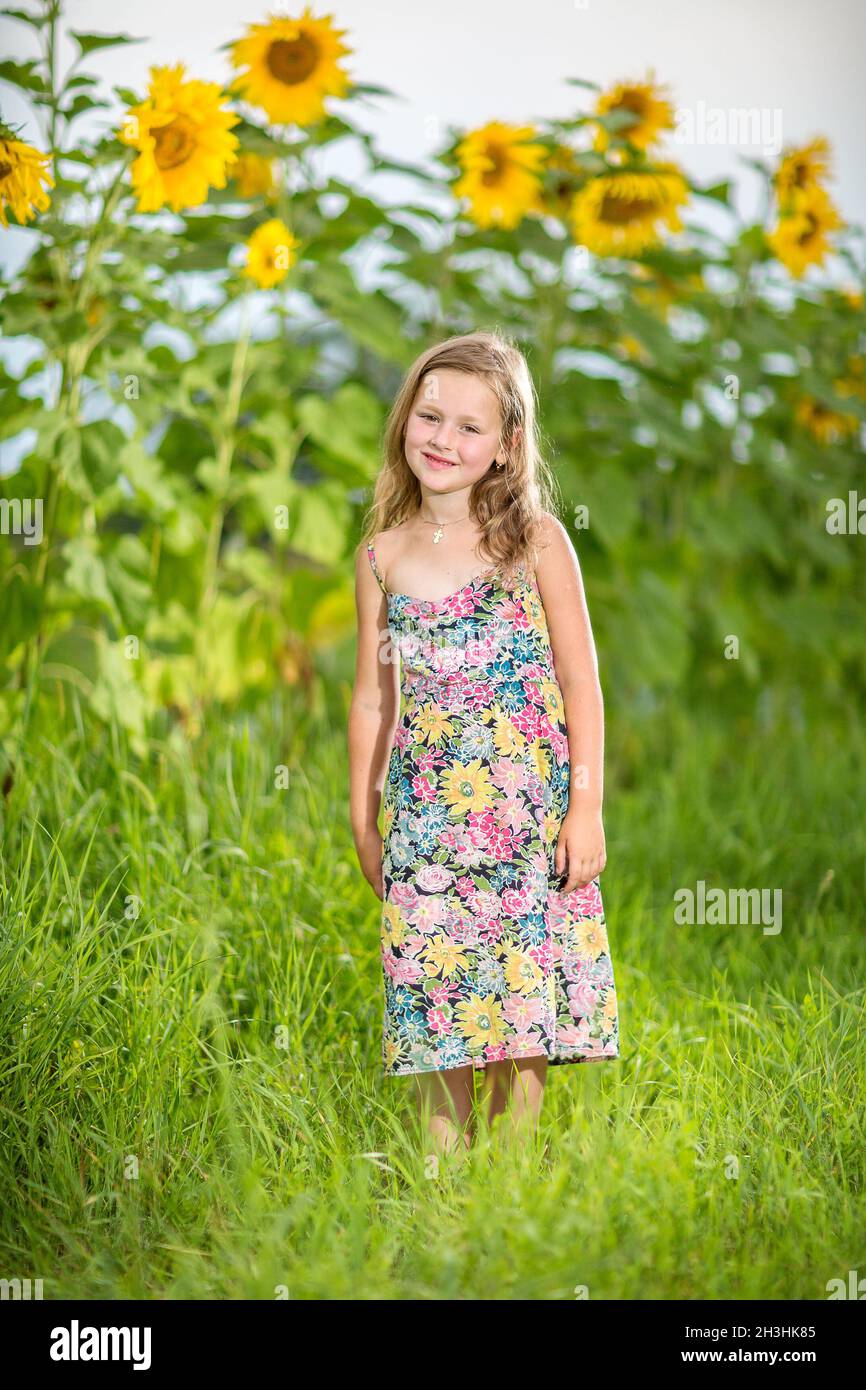 Portrait of a little girl in wreath of flowers Stock Photo - Alamy