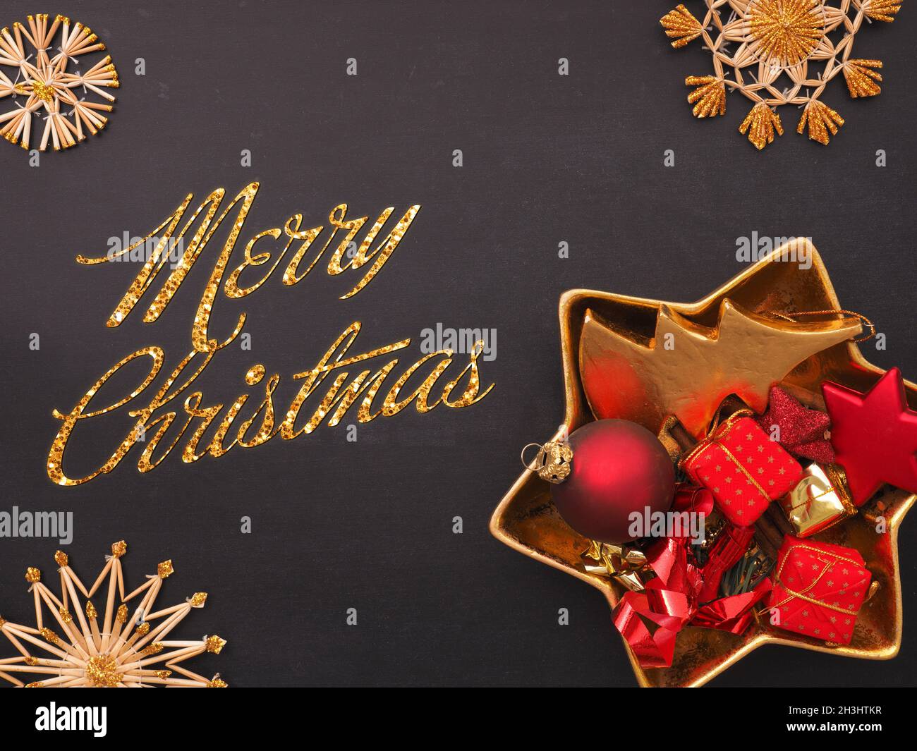 Christmas background with golden and red decorative items on a