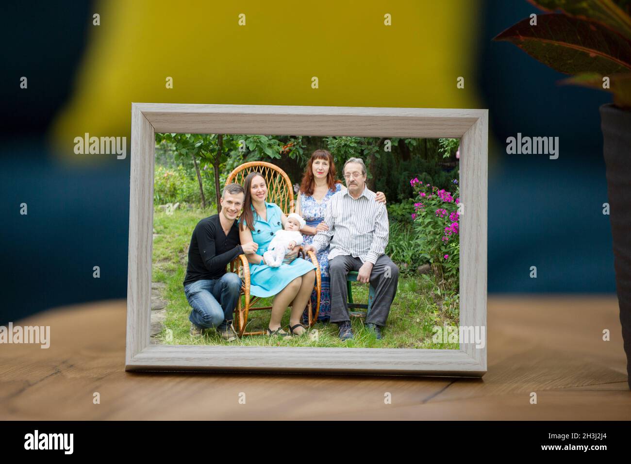Family photo in a frame on the table Stock Photo - Alamy