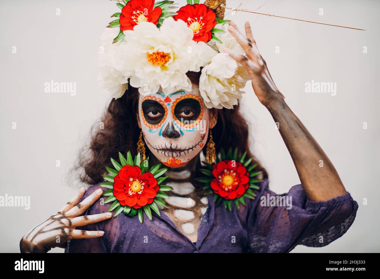 Woman with mexican skull halloween makeup on white background. Day of the dead aka Dia de los and halloween concept Stock Photo - Alamy