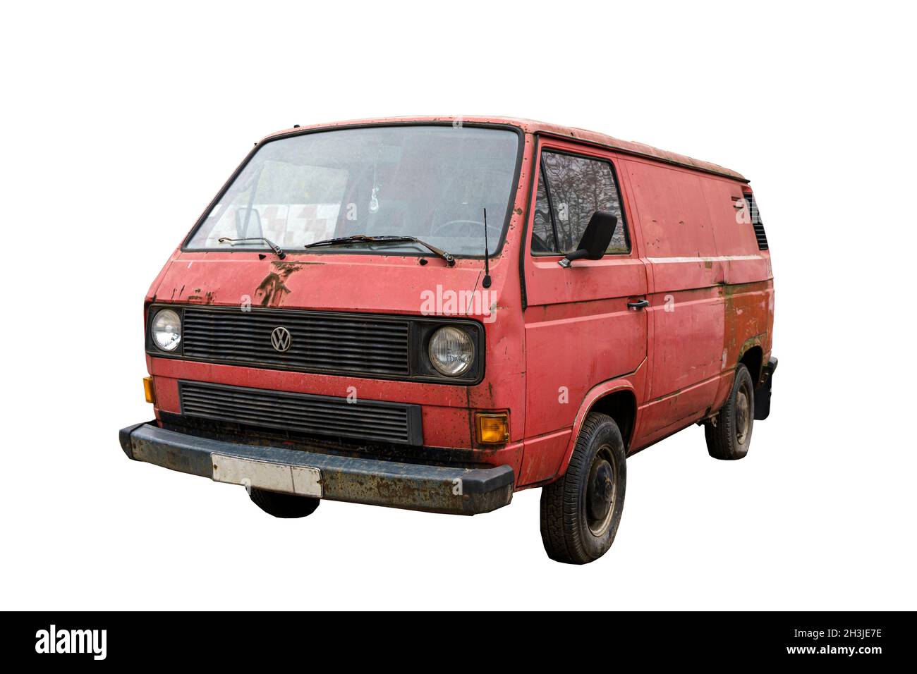Berlin, Germany - 29 October 2021: Volkswagen transporter t3 isolated. Old vintage red vw t3 on empty white background. Old crash trash mini bus van. High quality photo Stock Photo