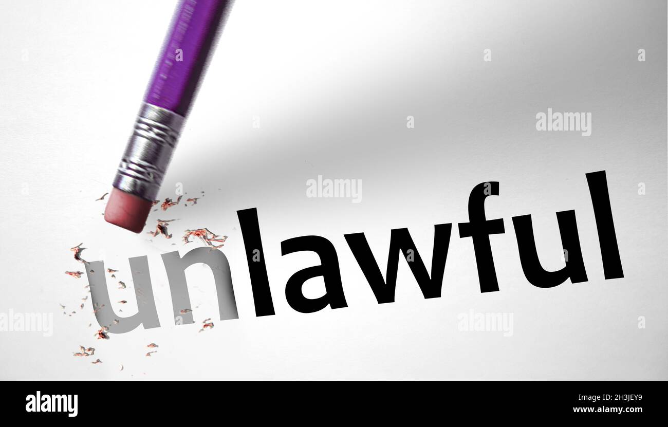 Eraser changing the word Unlawful for Lawful Stock Photo