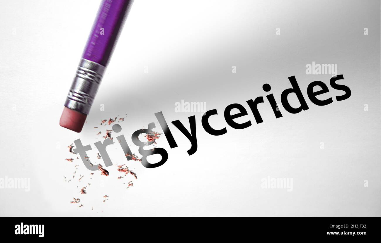 Eraser deleting the word Triglycerides Stock Photo