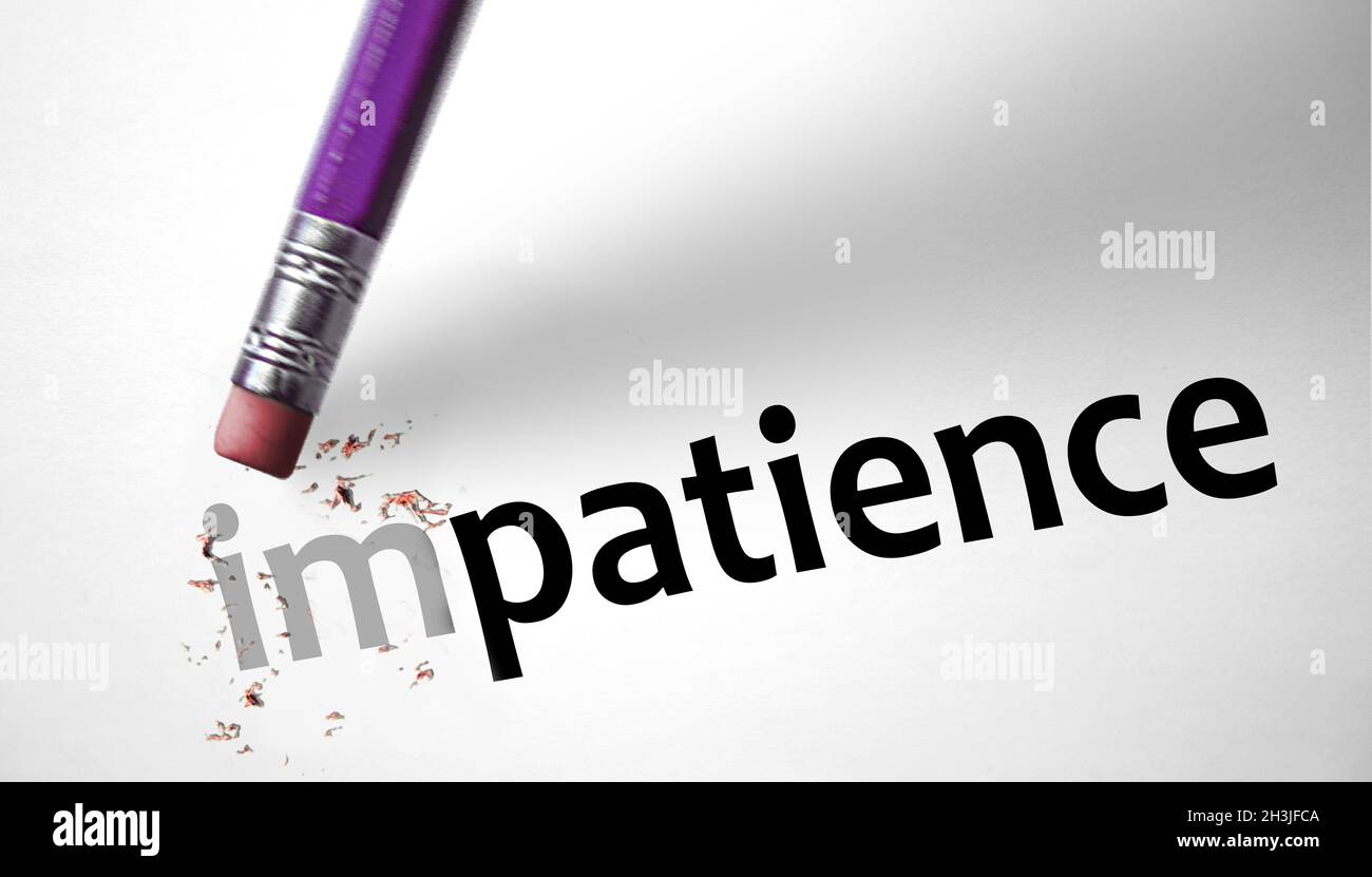 Eraser changing the word Impatience for Patience Stock Photo