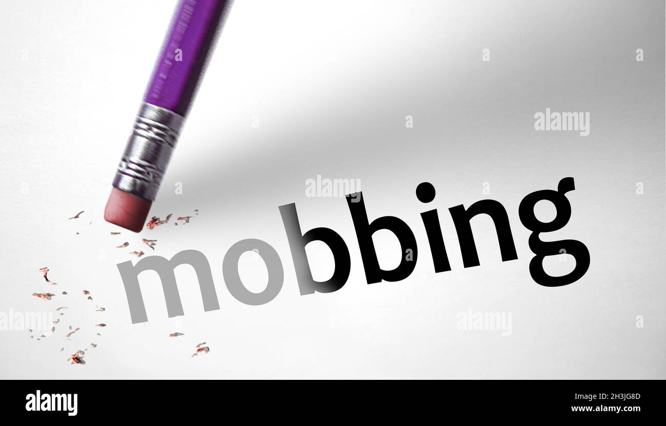 Eraser deleting the word Mobbing Stock Photo