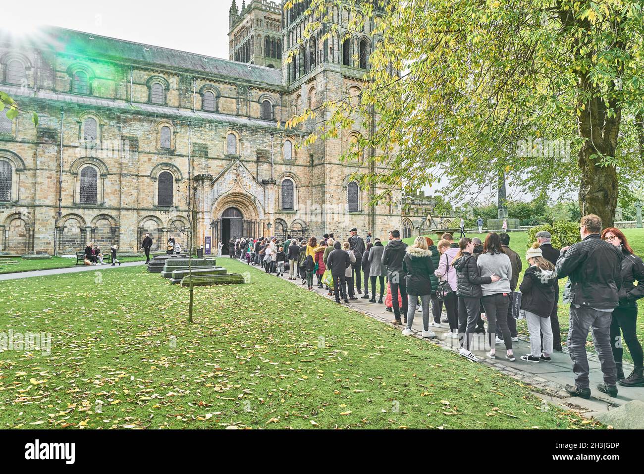 Orderly queue waiting to enter the cathedral at Durham, England, to see Luke Jerram's museum of the moon, october, 2021. Stock Photo