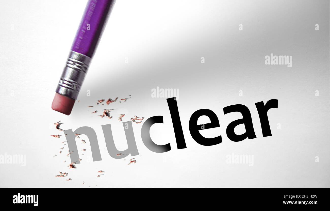 Eraser deleting the word Nuclear Stock Photo