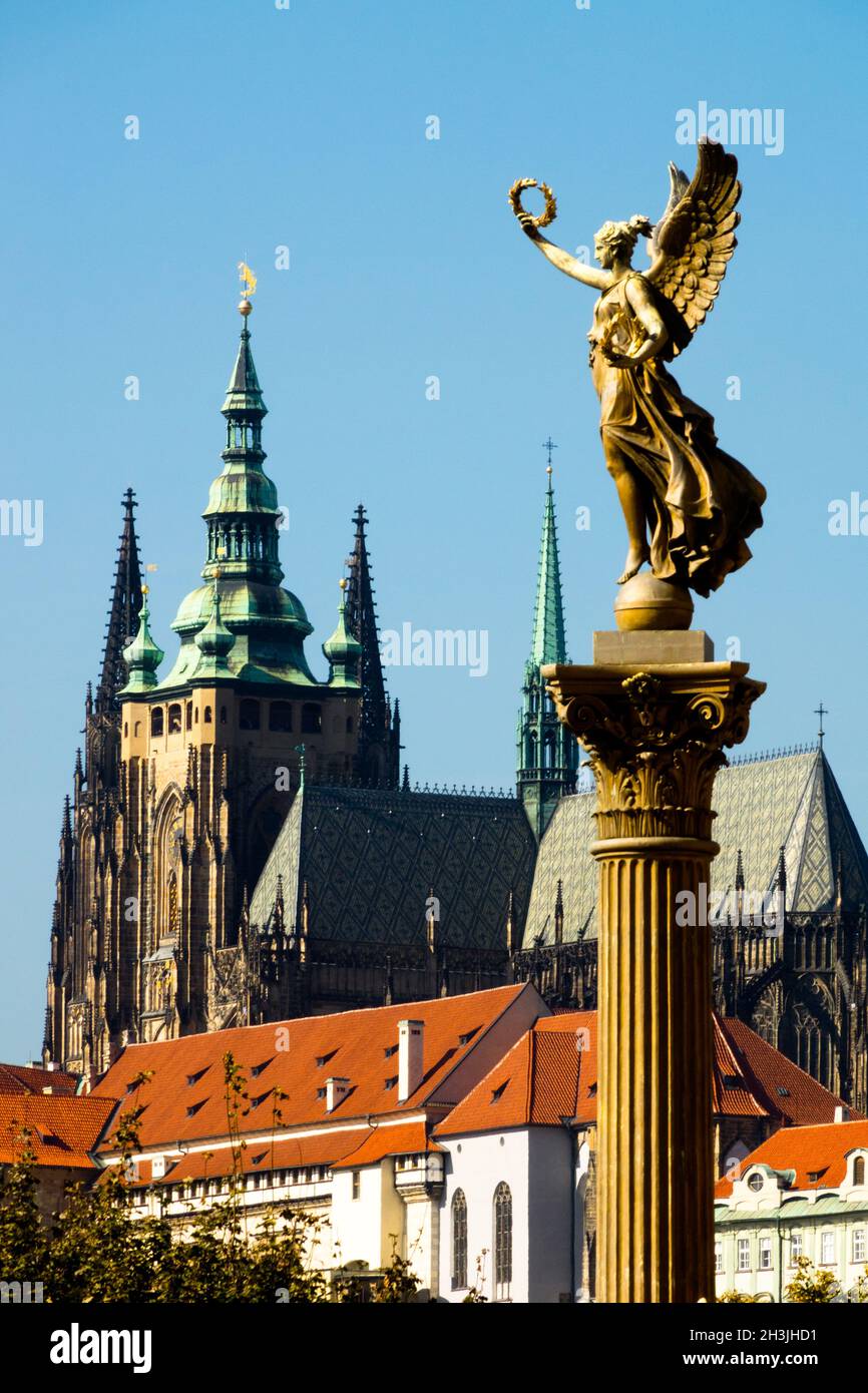 Prague Castle Prague statue Angel sculpture woman on the column, Prague St Vitus Cathedral Czech Republic Statue of the Muse Stock Photo