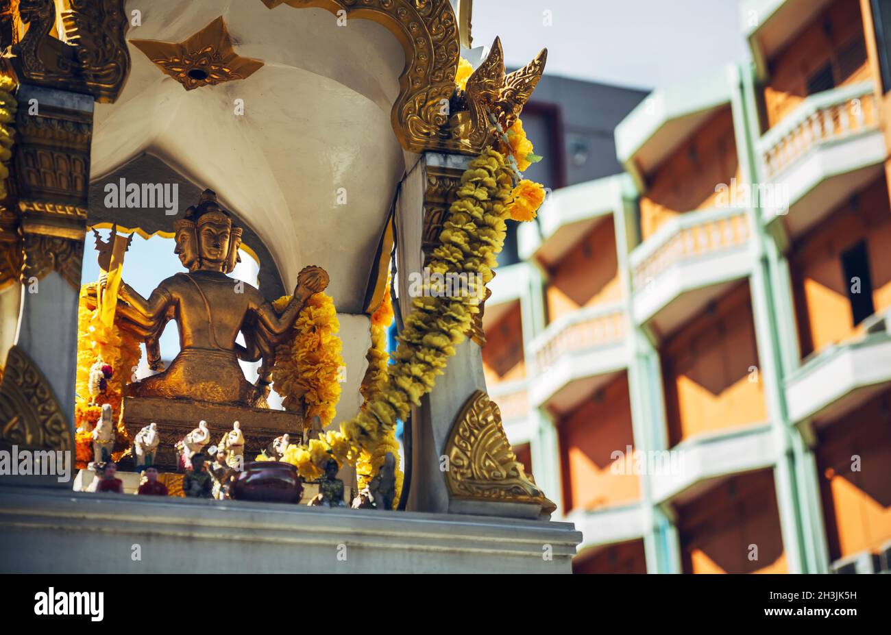 Phra Phrom altar in Bangkok street. Phra Phrom is the Thai representation of the Hindu god Brahma Stock Photo