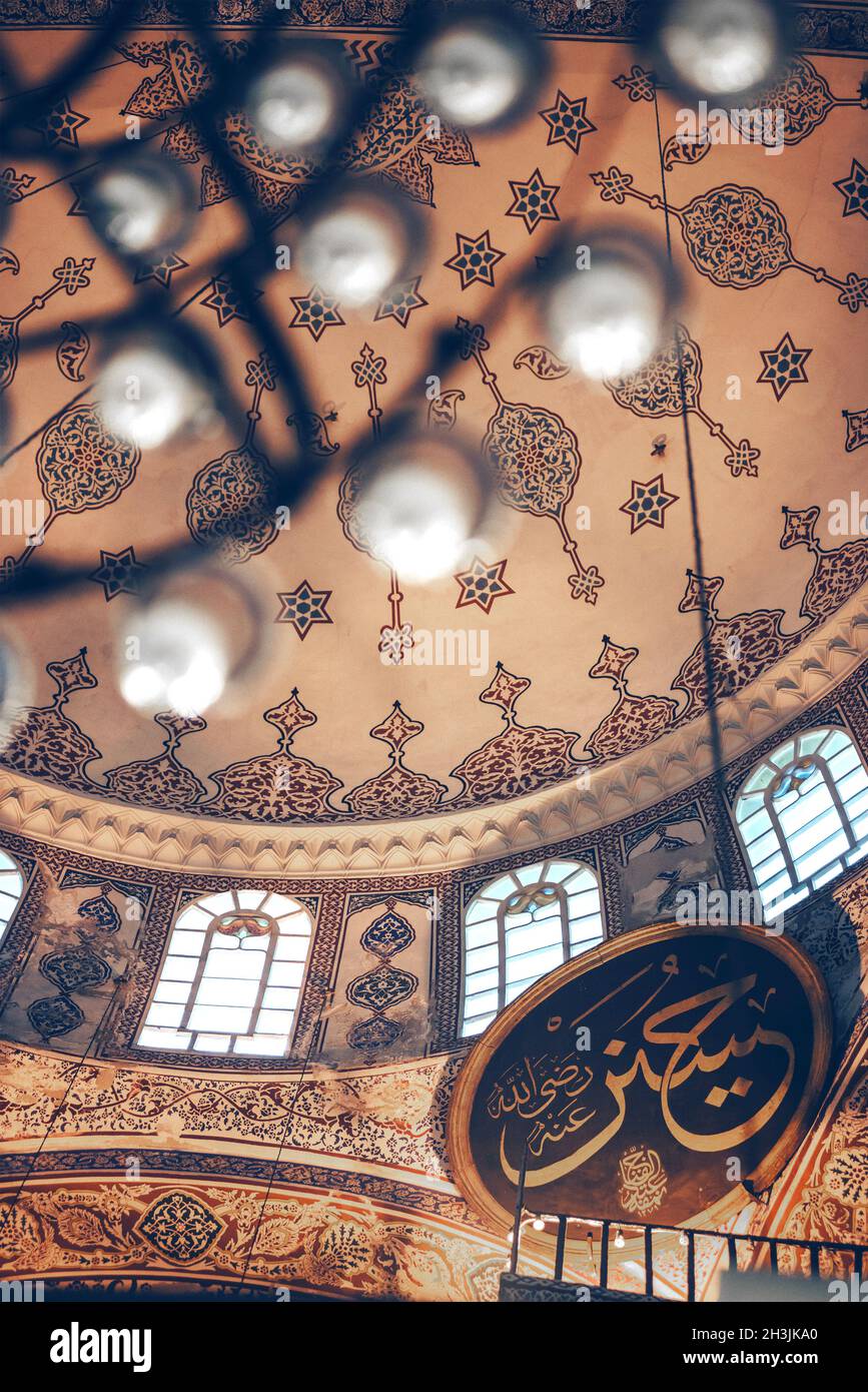 ISTANBUL, TURKEY - MAY 5, 2014: Beautiful decorated interior of the Yeni Cami, meaning New Mosque; originally the Valide Sultan Stock Photo