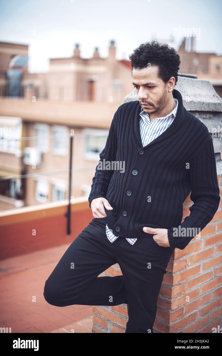 Confident attractive mulatto man in urban environment Stock Photo