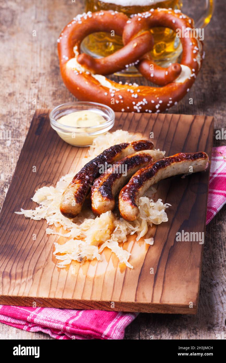 Grilled sausages with sauerkraut Stock Photo